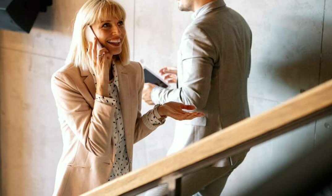 busy-business-people-on-stairs-in-modern-office-P9R9W22